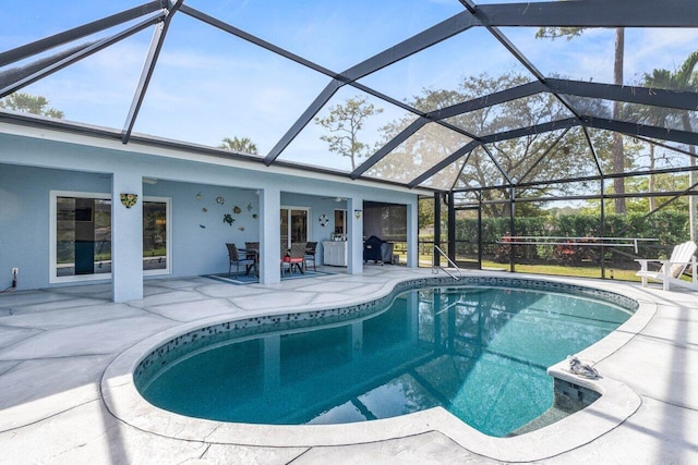 view of pool featuring a lanai and a patio