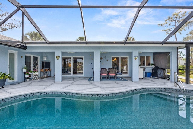 back of property featuring a patio, a lanai, and ceiling fan