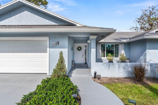 doorway to property featuring a garage