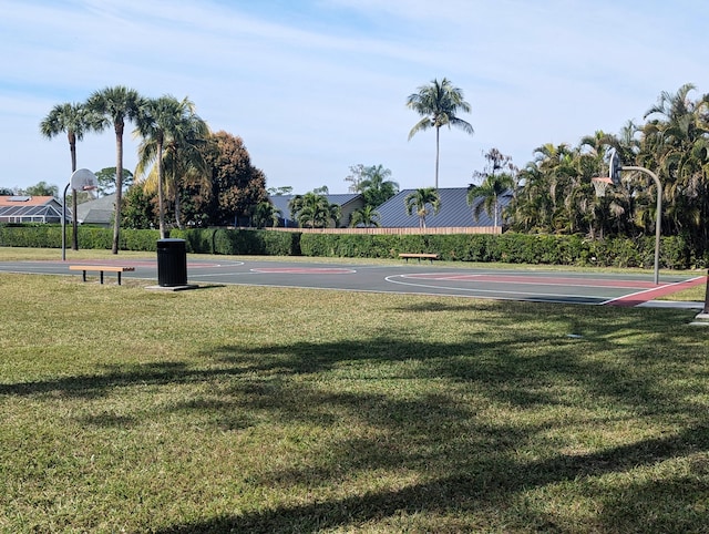 view of basketball court featuring a yard