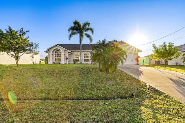 view of front of property featuring a garage and a front yard