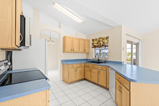 kitchen featuring light brown cabinetry, dishwasher, lofted ceiling, sink, and range