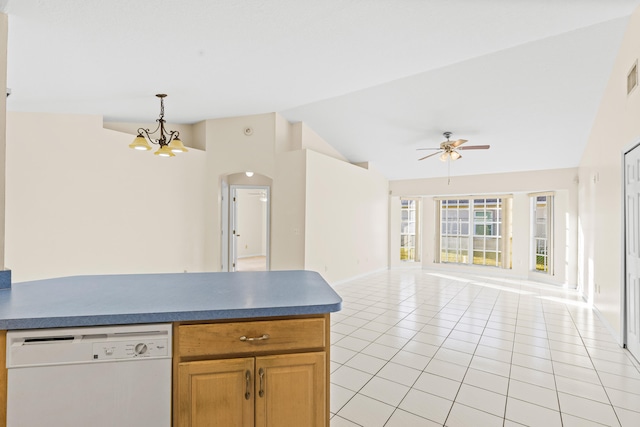 kitchen featuring pendant lighting, lofted ceiling, white dishwasher, light tile patterned flooring, and ceiling fan with notable chandelier