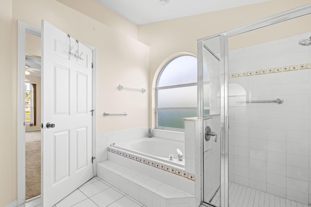 bathroom with tile patterned floors and independent shower and bath