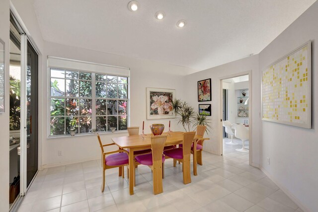 kitchen featuring white cabinetry, appliances with stainless steel finishes, kitchen peninsula, and a kitchen island