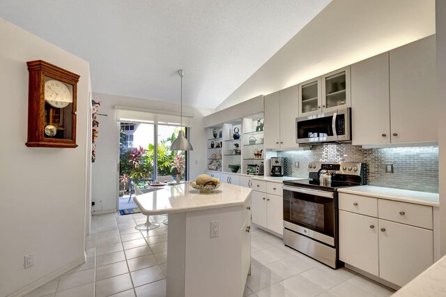 tiled dining space with a textured ceiling