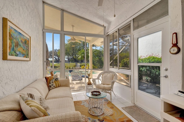 sunroom featuring ceiling fan