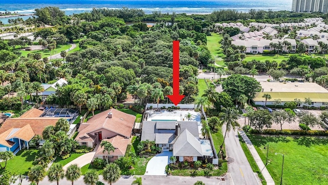 birds eye view of property with a water view