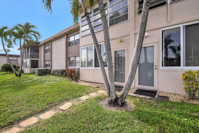 doorway to property with a yard