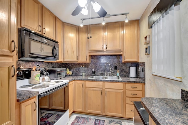 kitchen with sink, dark stone countertops, electric stove, ceiling fan, and backsplash