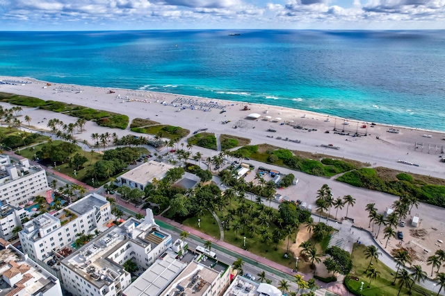 birds eye view of property featuring a view of the beach and a water view