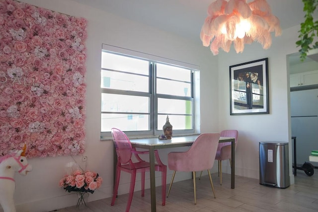 dining space with light wood-type flooring