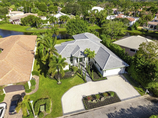 birds eye view of property with a water view