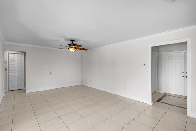 tiled empty room featuring crown molding and ceiling fan