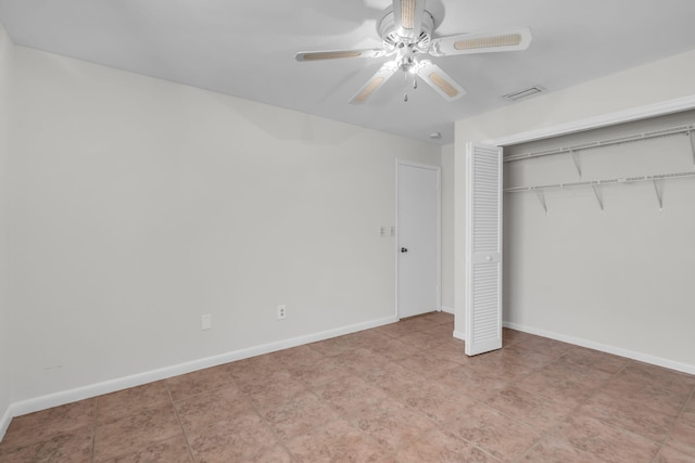 unfurnished bedroom with a closet and ceiling fan