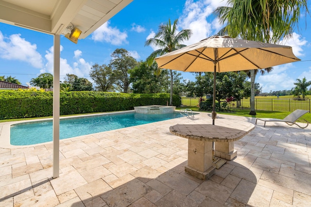 view of swimming pool with an in ground hot tub and a patio