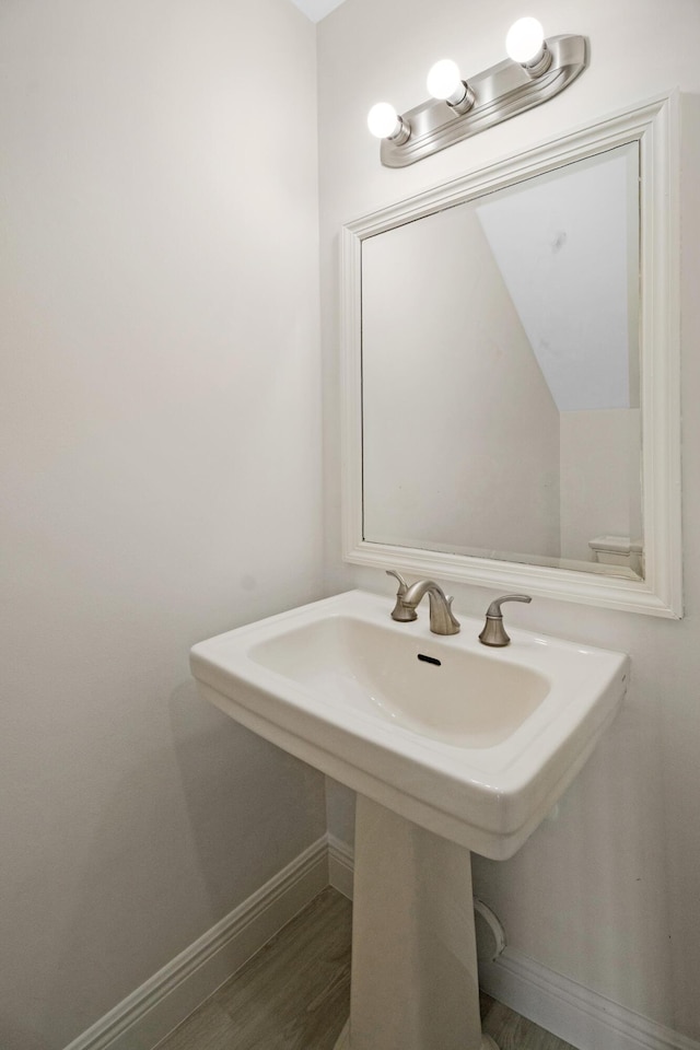 bathroom featuring sink and hardwood / wood-style floors