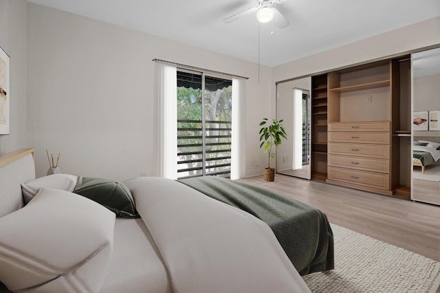 bedroom featuring light hardwood / wood-style floors, a closet, and ceiling fan