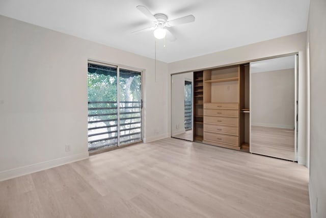 unfurnished bedroom featuring ceiling fan, access to exterior, light hardwood / wood-style floors, and a closet