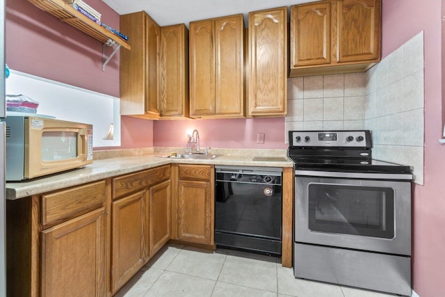 kitchen featuring stainless steel electric stove, dishwasher, sink, backsplash, and light tile patterned floors