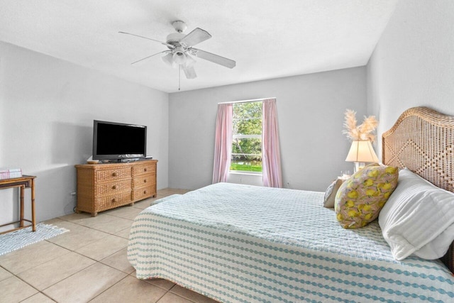 tiled bedroom featuring ceiling fan