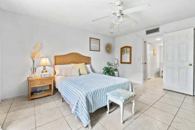 tiled bedroom with ceiling fan