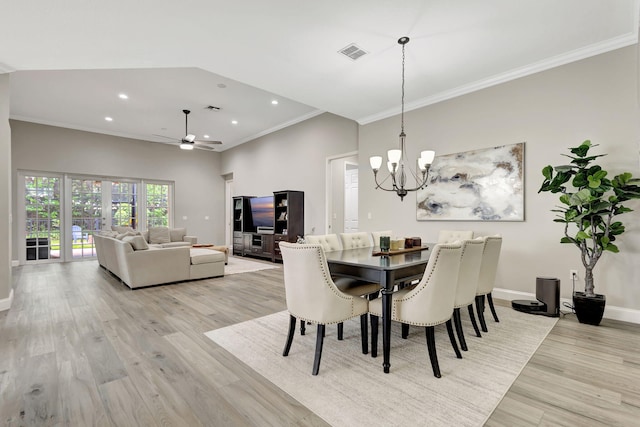 dining area featuring crown molding, ceiling fan with notable chandelier, light wood-type flooring, and french doors