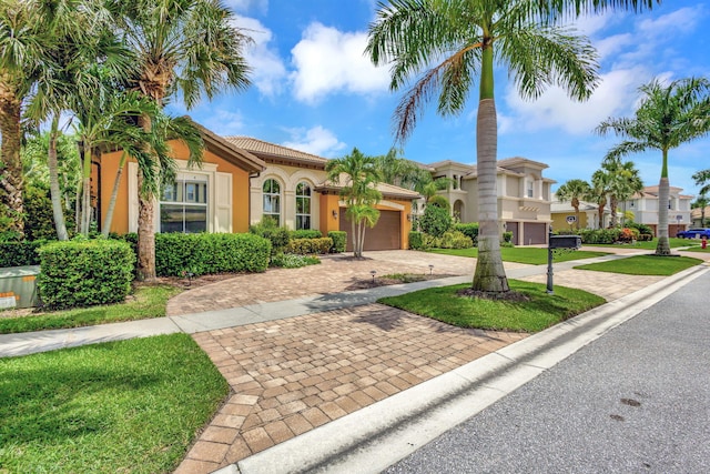 mediterranean / spanish house with a garage