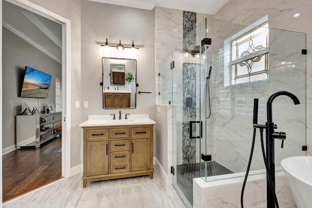 bathroom featuring vanity, ornamental molding, and independent shower and bath