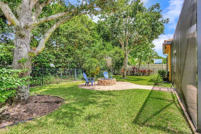 view of yard with a patio area and a fire pit