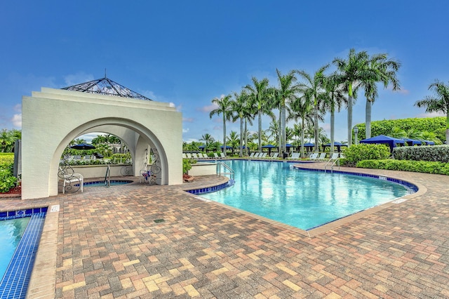 view of swimming pool featuring a patio area