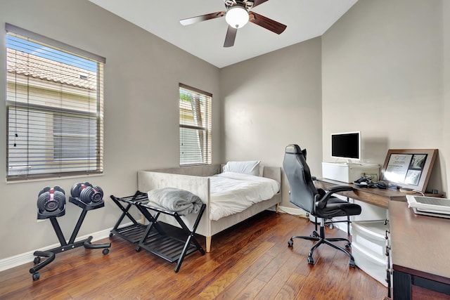 bedroom featuring dark hardwood / wood-style flooring and ceiling fan