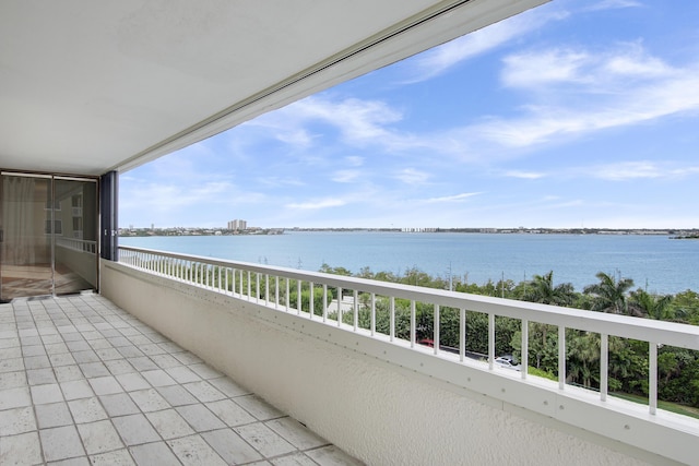 balcony featuring a water view