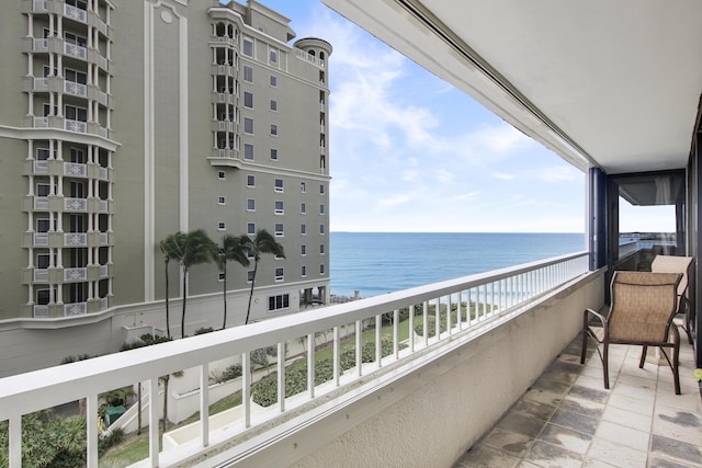 balcony featuring a water view