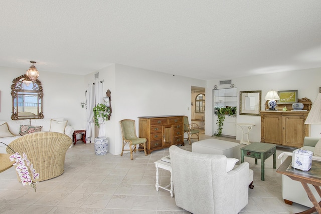 living room with a textured ceiling