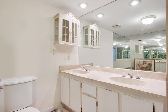 bathroom with vanity and toilet