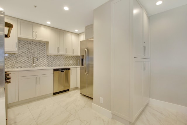 kitchen featuring stainless steel appliances, sink, and decorative backsplash