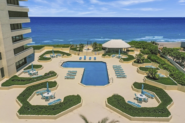 view of pool featuring a water view