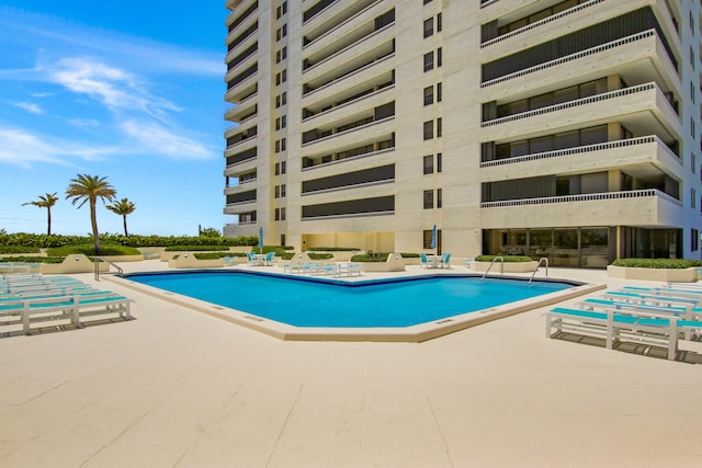 view of swimming pool featuring a patio area