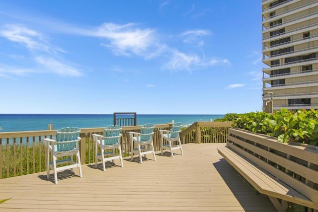 wooden deck with a water view