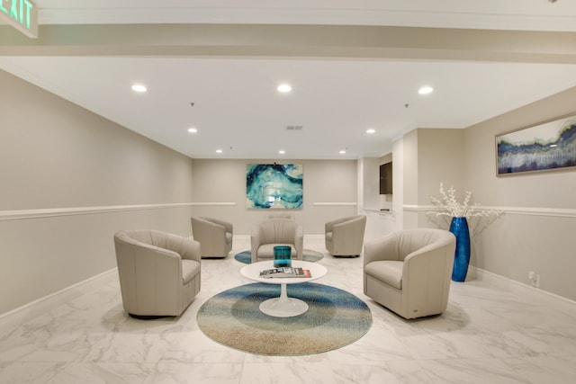 living room with ornamental molding