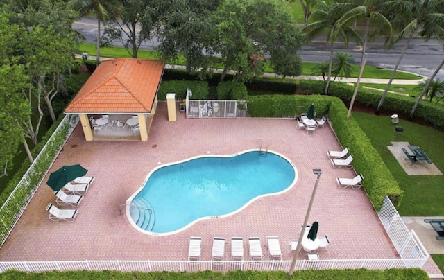 view of swimming pool featuring a patio and a gazebo