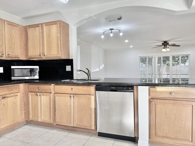 kitchen with sink, light brown cabinets, stainless steel appliances, and light tile patterned floors