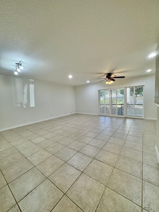 unfurnished room with light tile patterned floors, a textured ceiling, and ceiling fan