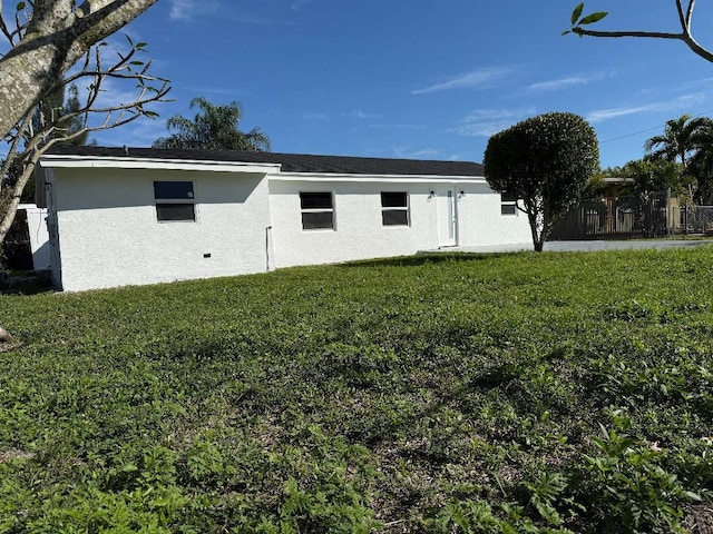 view of property exterior with a yard