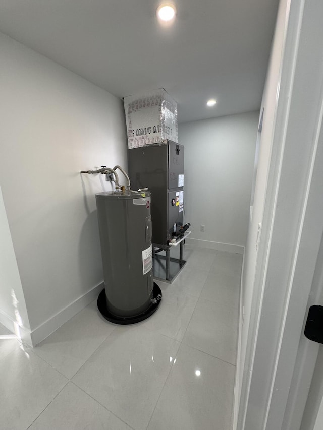 utility room featuring electric water heater