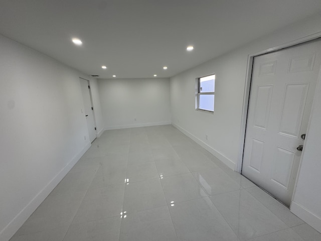 spare room with light tile patterned floors