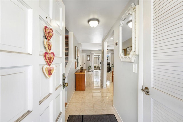 hallway featuring light tile patterned flooring