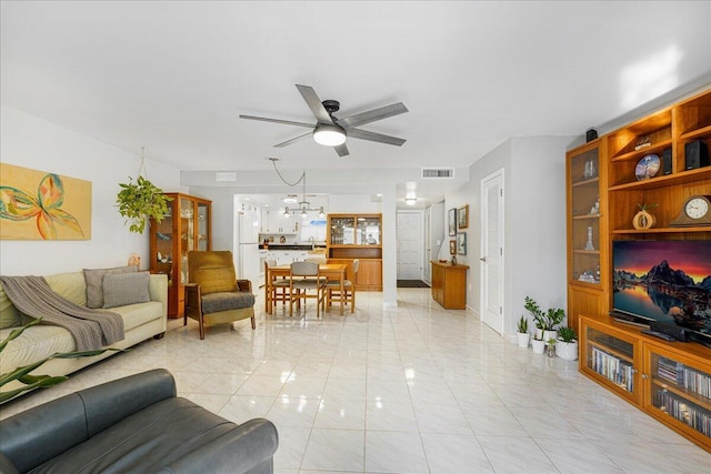 living room with light tile patterned floors and ceiling fan