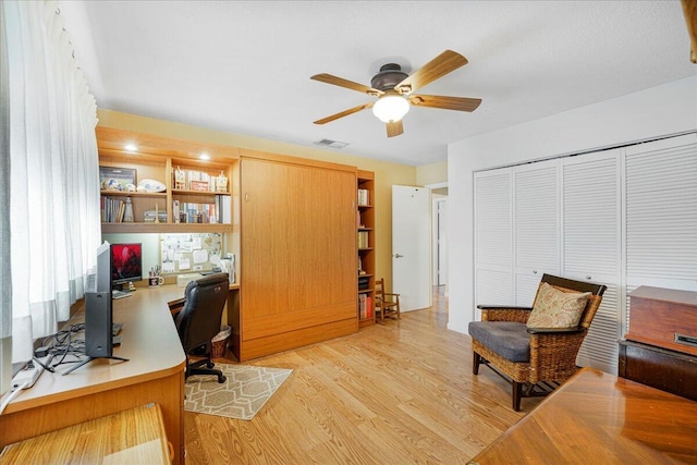 office with ceiling fan and light wood-type flooring